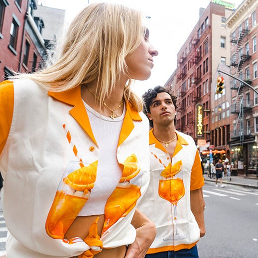 Guy and girl wearing Aperol Spritz shirts in Little Italy, Manhattan