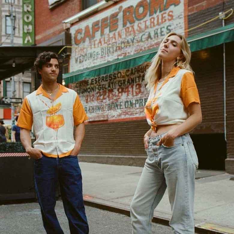 Girl and guy wearing Aperol Spritz shirts 