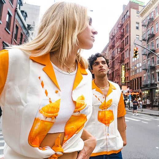Guy and girl wearing Aperol Spritz shirts in Little Italy, Manhattan 